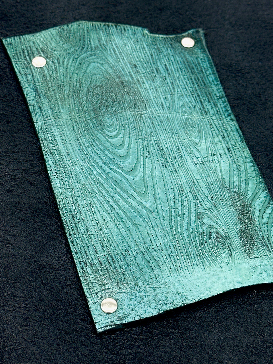 detail of embossed wood grain leather on journal cover