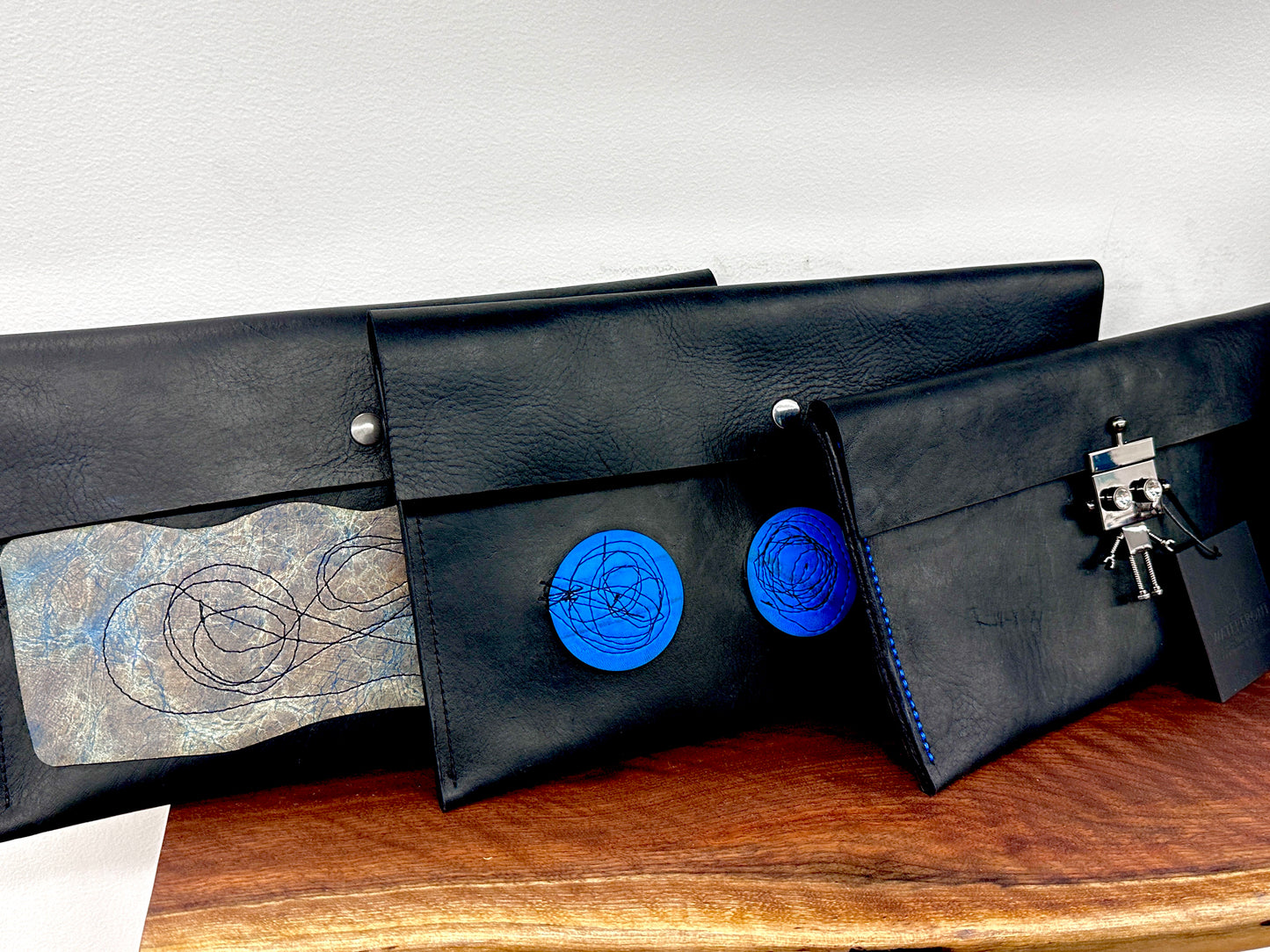 Black Leather Clutch Purse with Blue Gray Stitched Applique Details