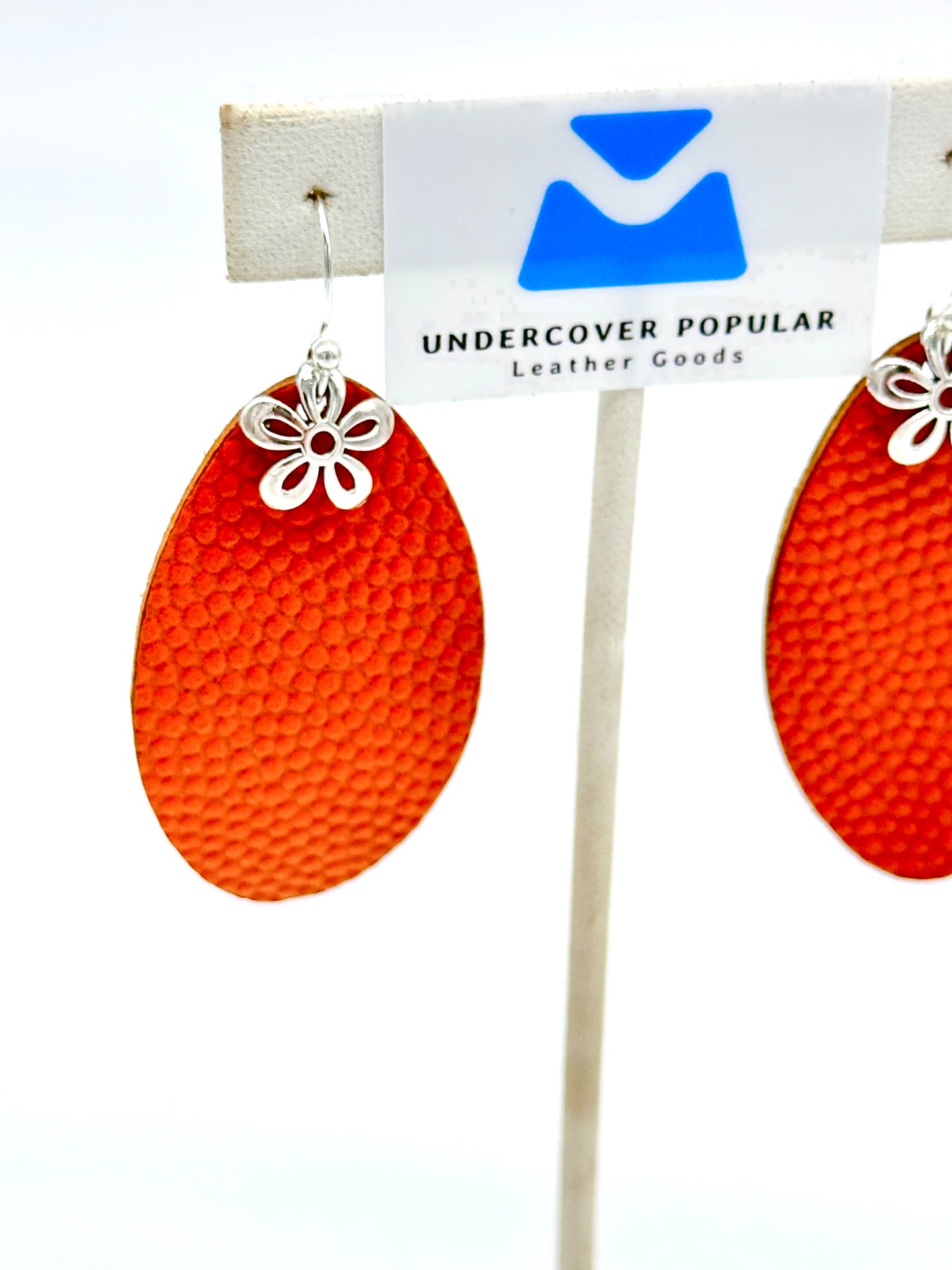 Basketball leather earrings in orange pebbled leather