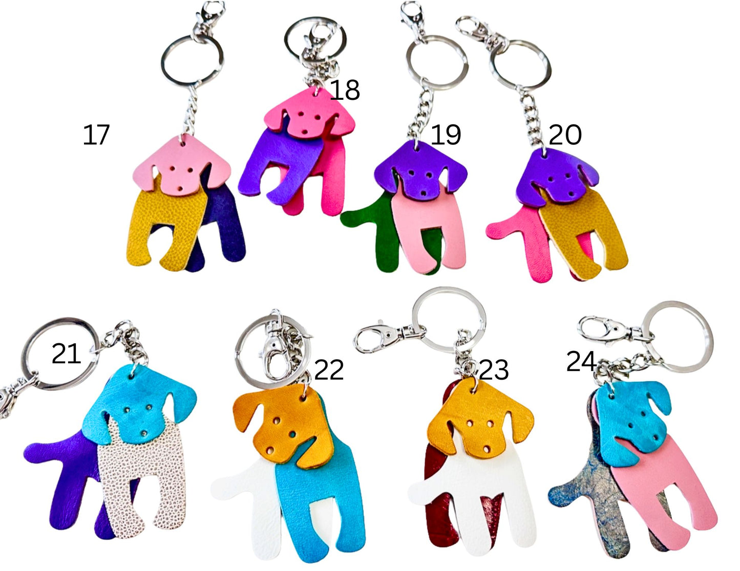 Colorful dog-shaped keychains with numbers on a white background