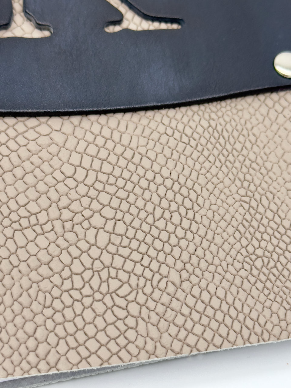 close up of snake print embossed leather texture
