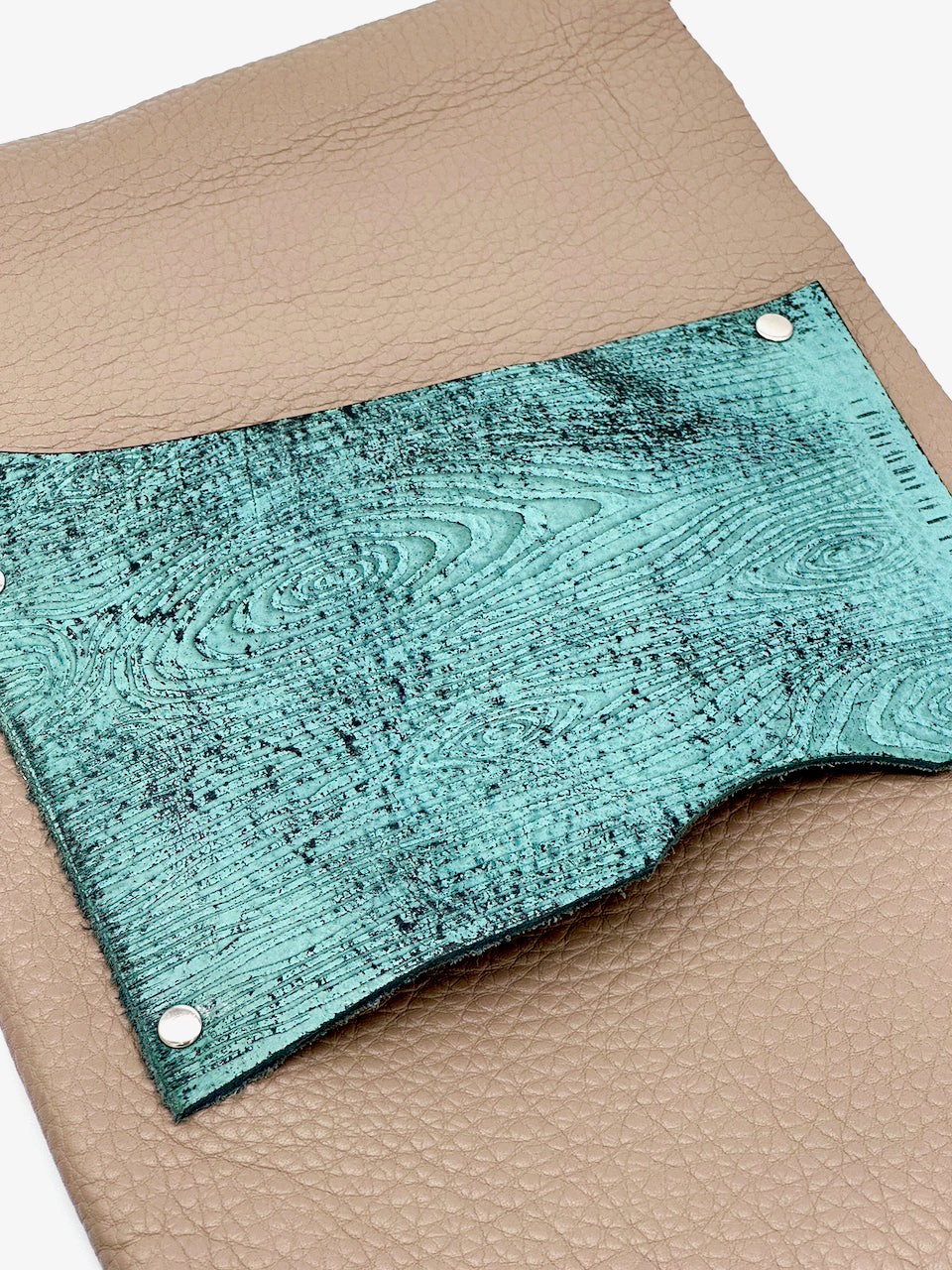 wood grain embossed leather detail on cover of beige and blue leather refillable journal