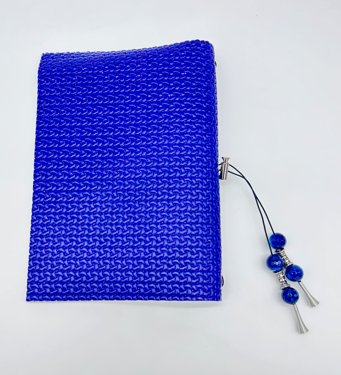 the back cover of a blue leather journal