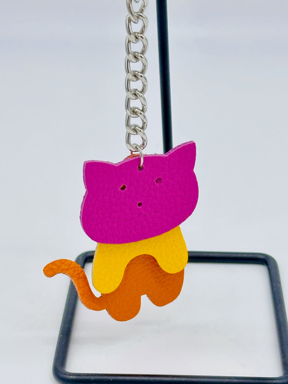 hanging key chain made of three cat parts