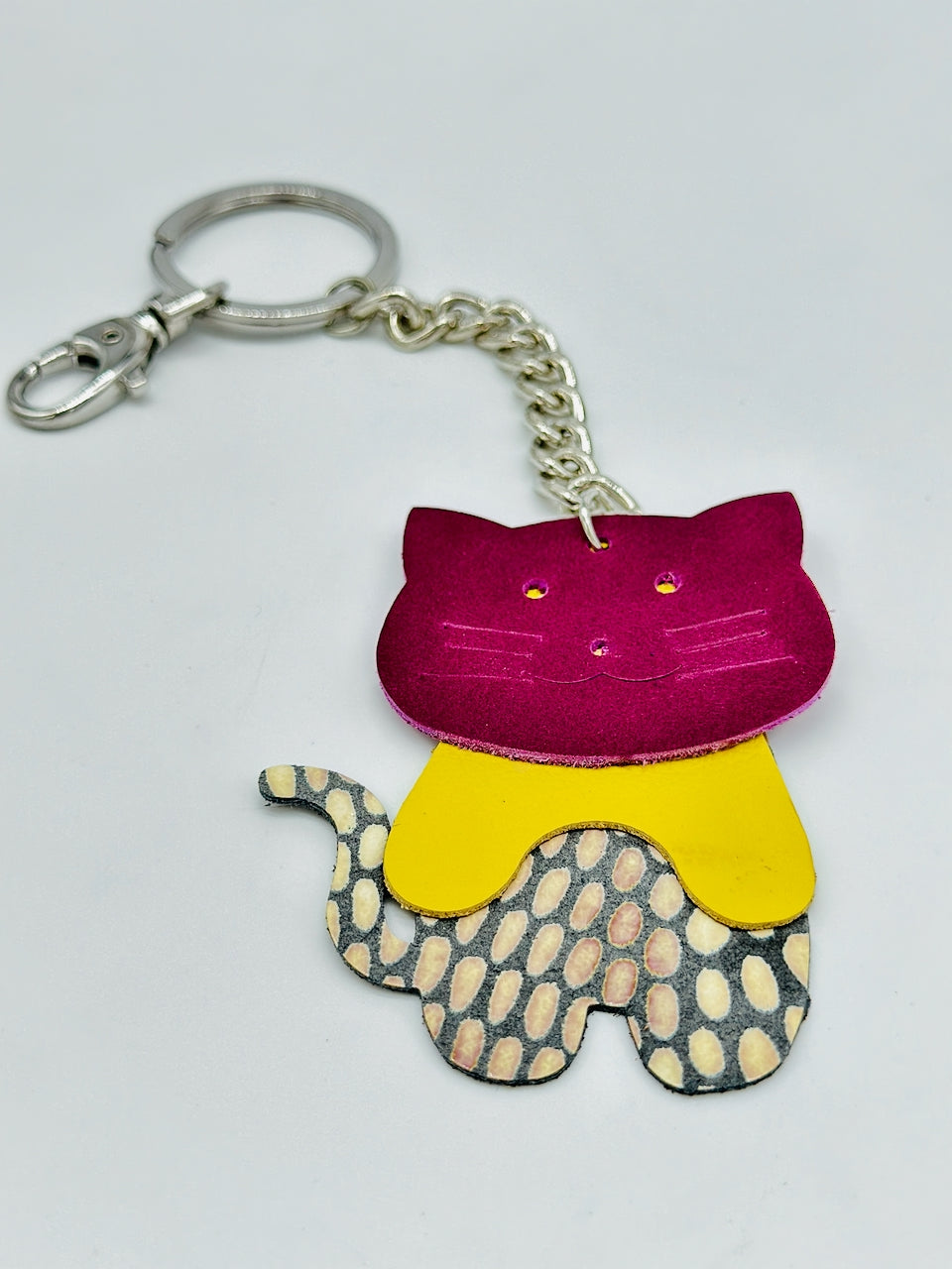 leather cat key chain purse fob flat on table