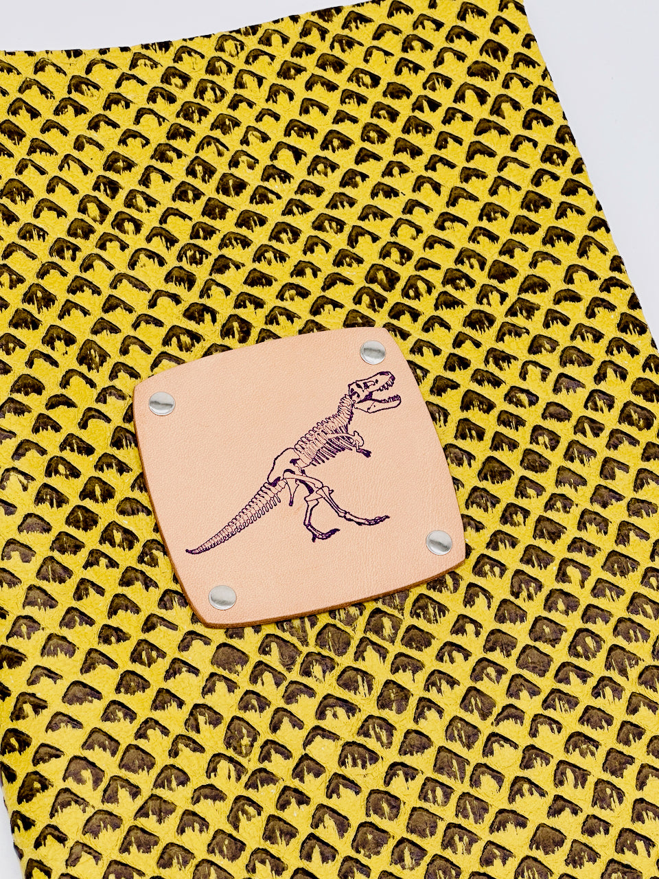 leather journal by undercover popular leather goods with a dinosaur on the cover