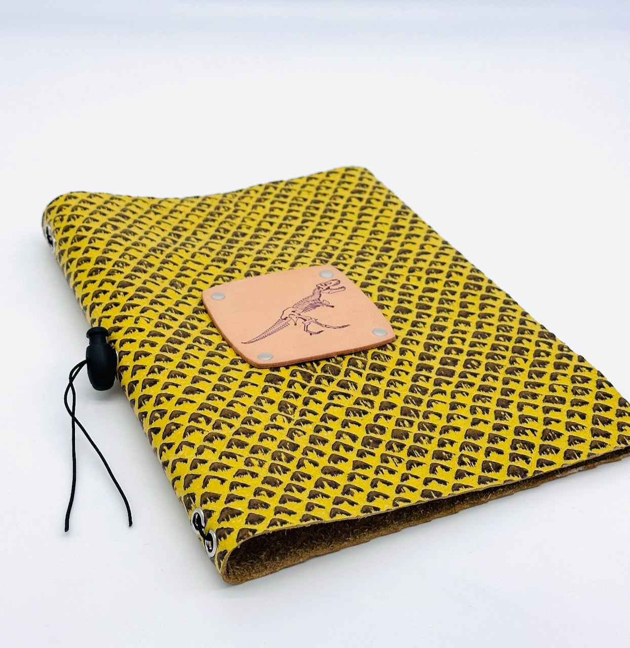 low angle leather journal in yellow and brown leather