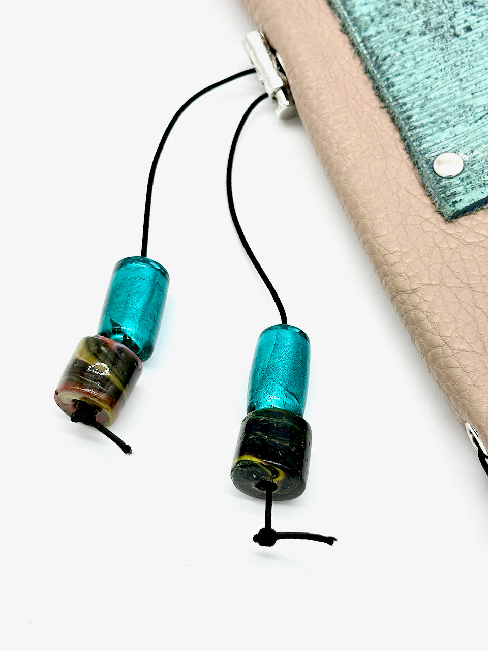 detail of glass beads on tassel on leather journal