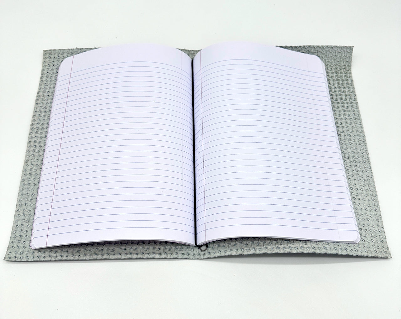 interior view of paper notebook insert in leather covered journal