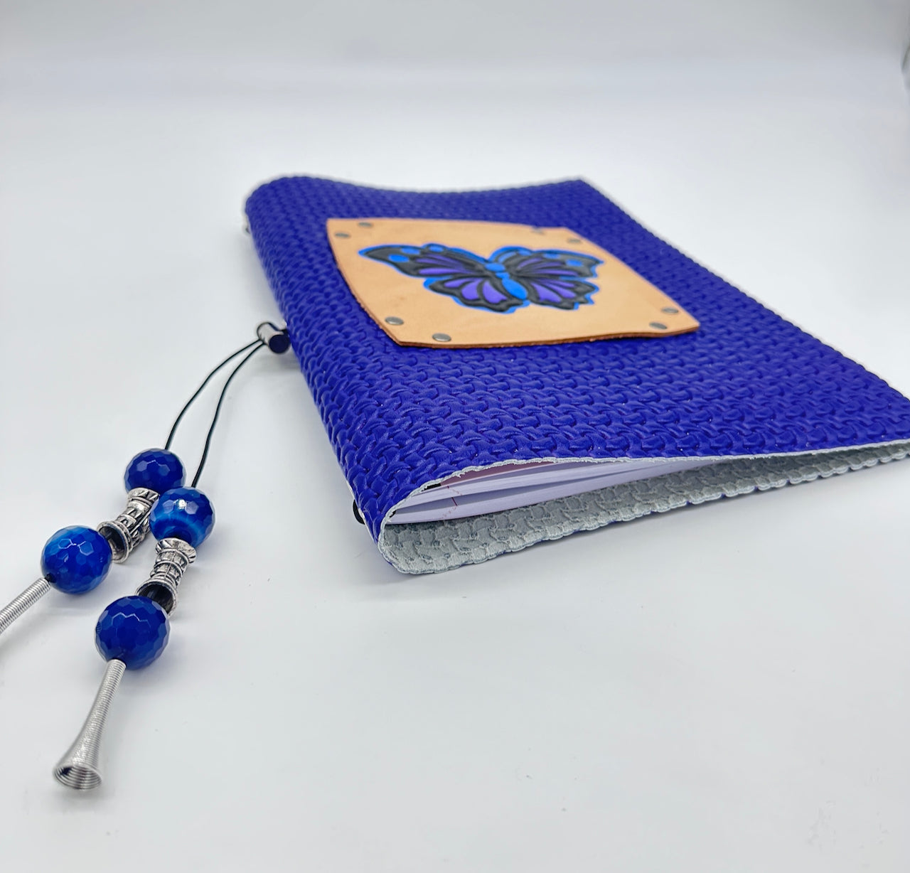 very pretty leather covered lined journal diary with a butterfly embossed image on the front