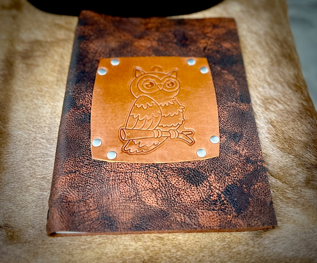 low angle beautiful owl leather journal made my Undercover Popular Leather Goods