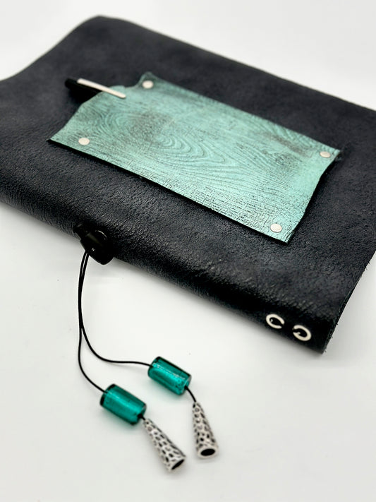 spine and front cover of leather journal with faux wood embossed leather flap