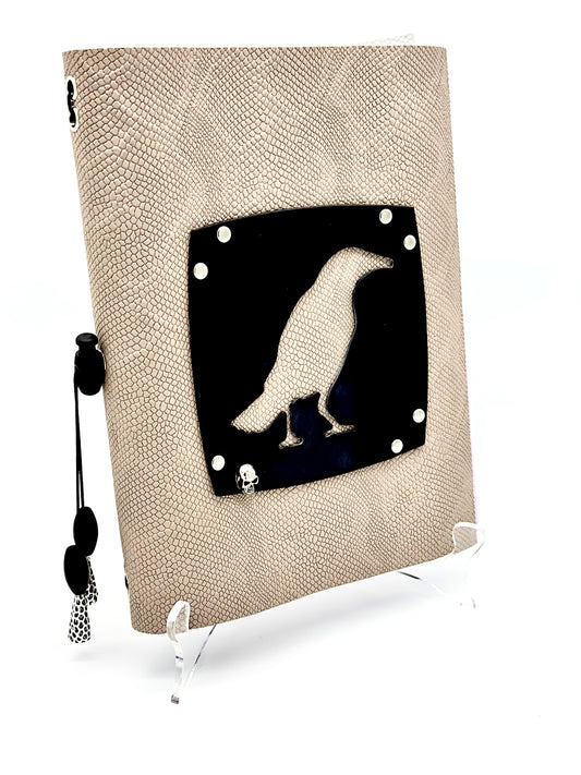 Leather covered blank journal featuring a Black Crow on a Gray Snake Print embossed Leather 