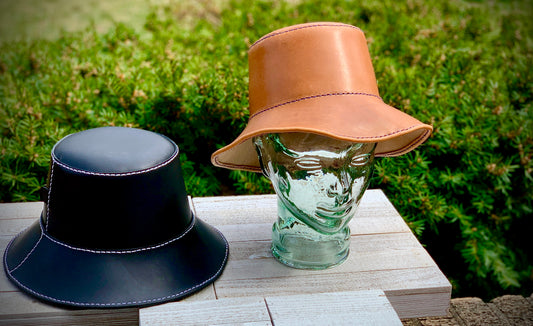 Black and Caramel colored leather bucket hats