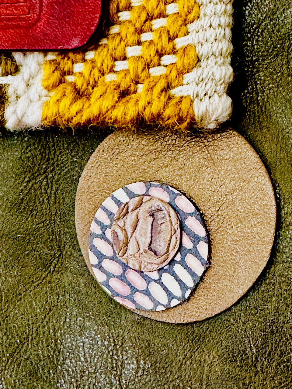 Close-up of a textured leather circles  featuring a patterned design.