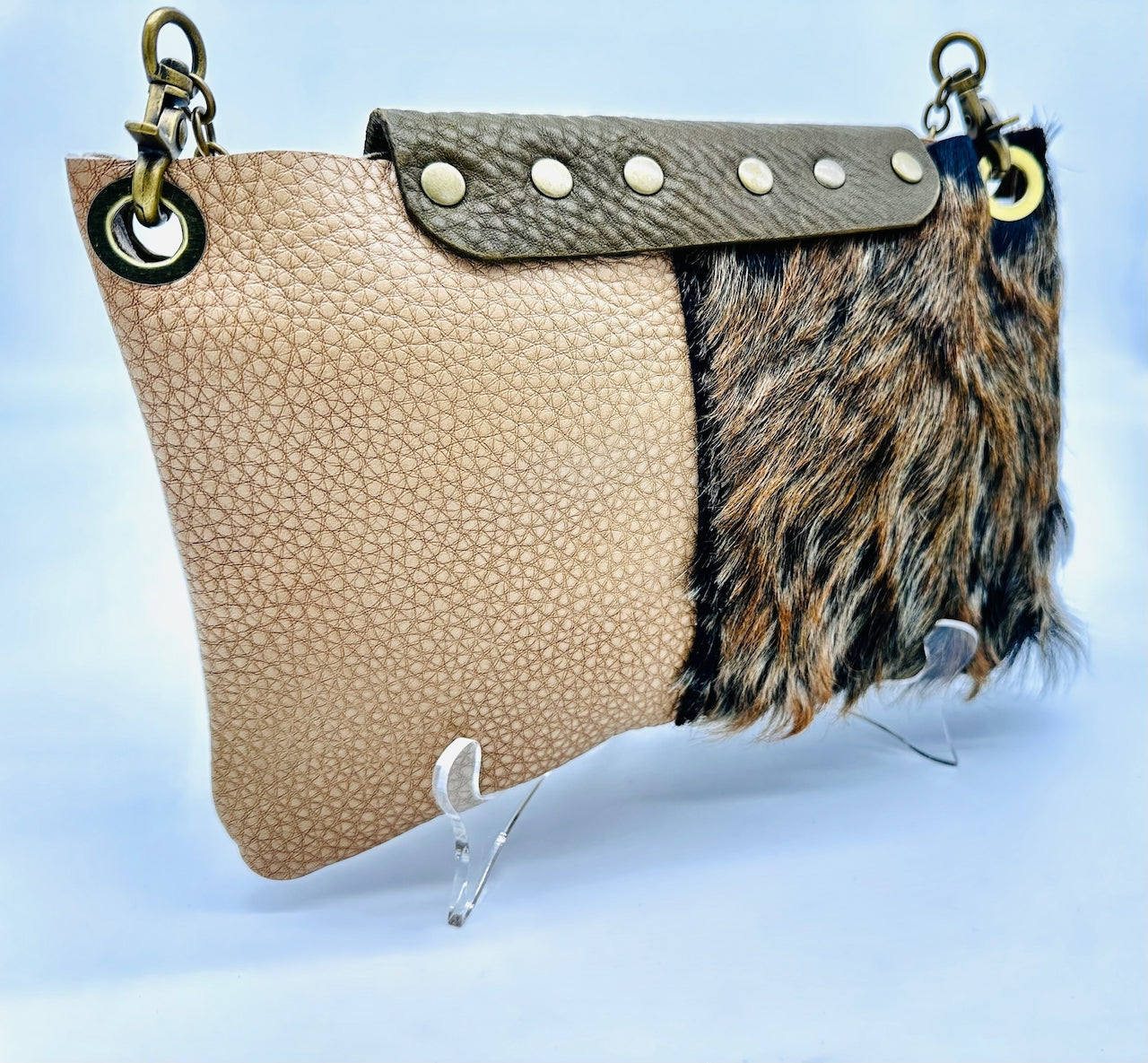 Back of leather purse featuring hair on hide panel