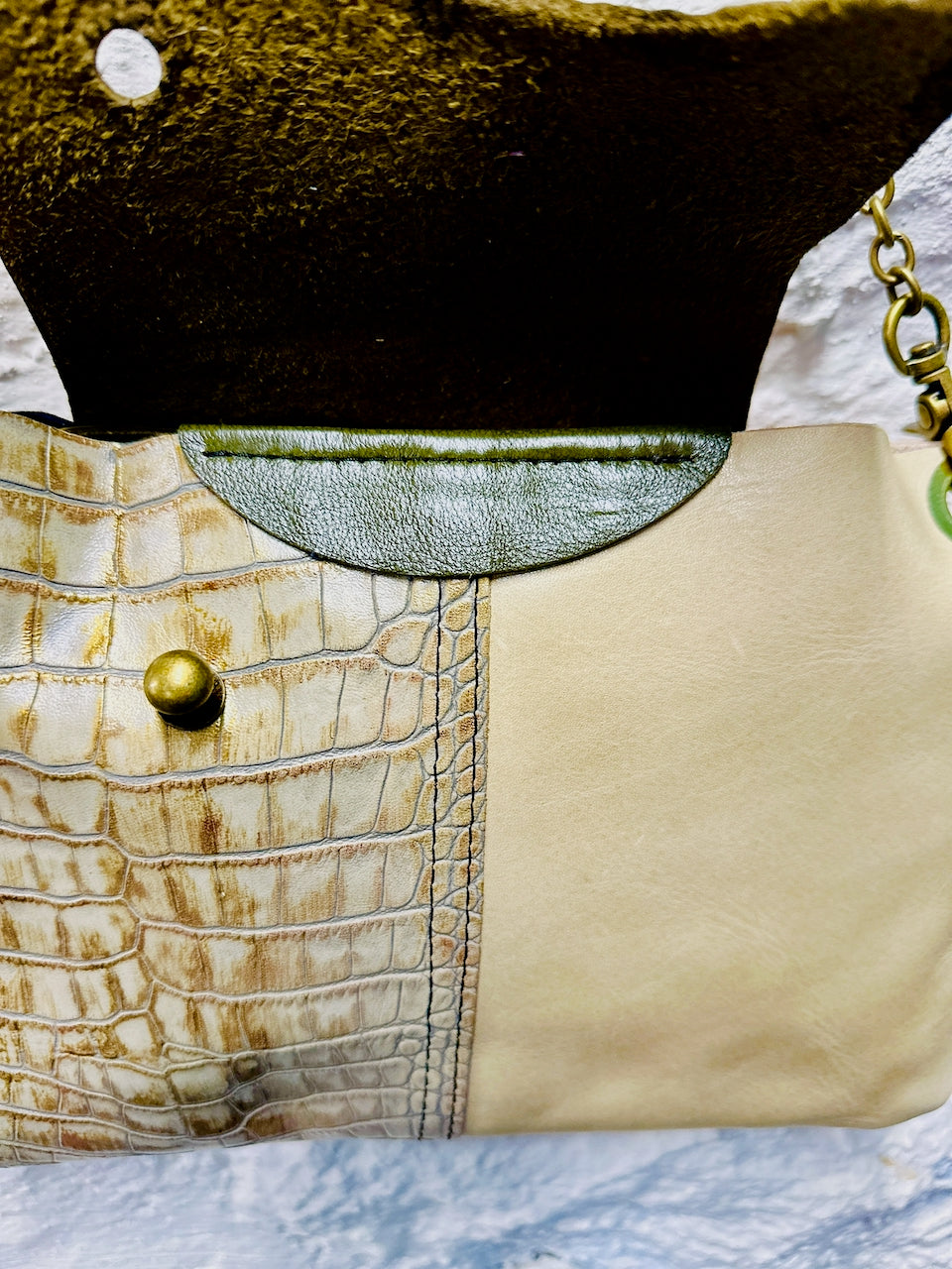 Inside leather purse showing gold crocdile printed leather