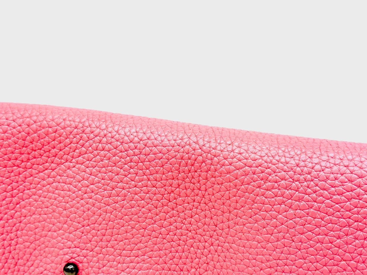 Close-up of a pink textured leather