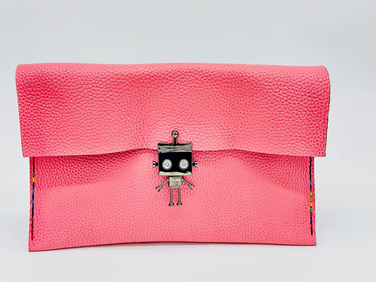 Pink clutch bag with a robot clasp on a light background
