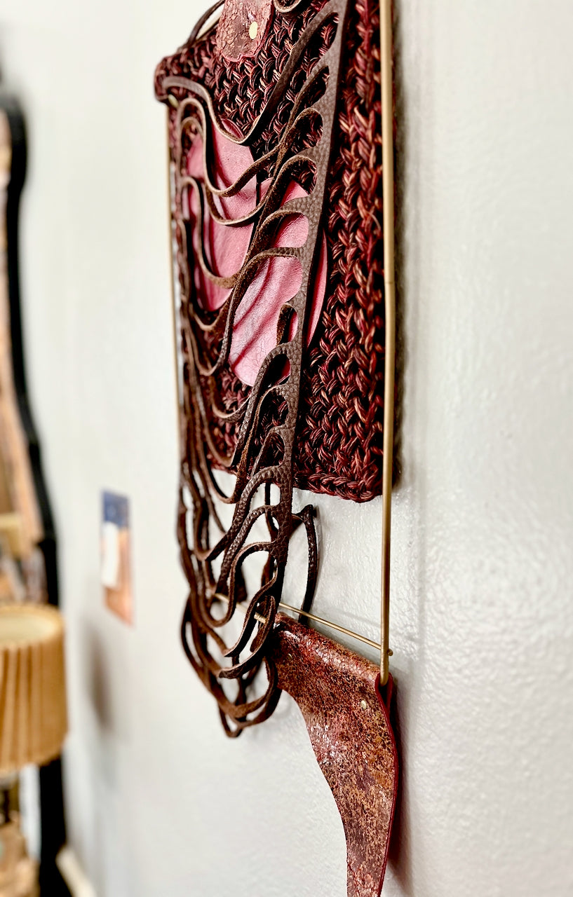 Decorative wall art with intricate designs on a white wall