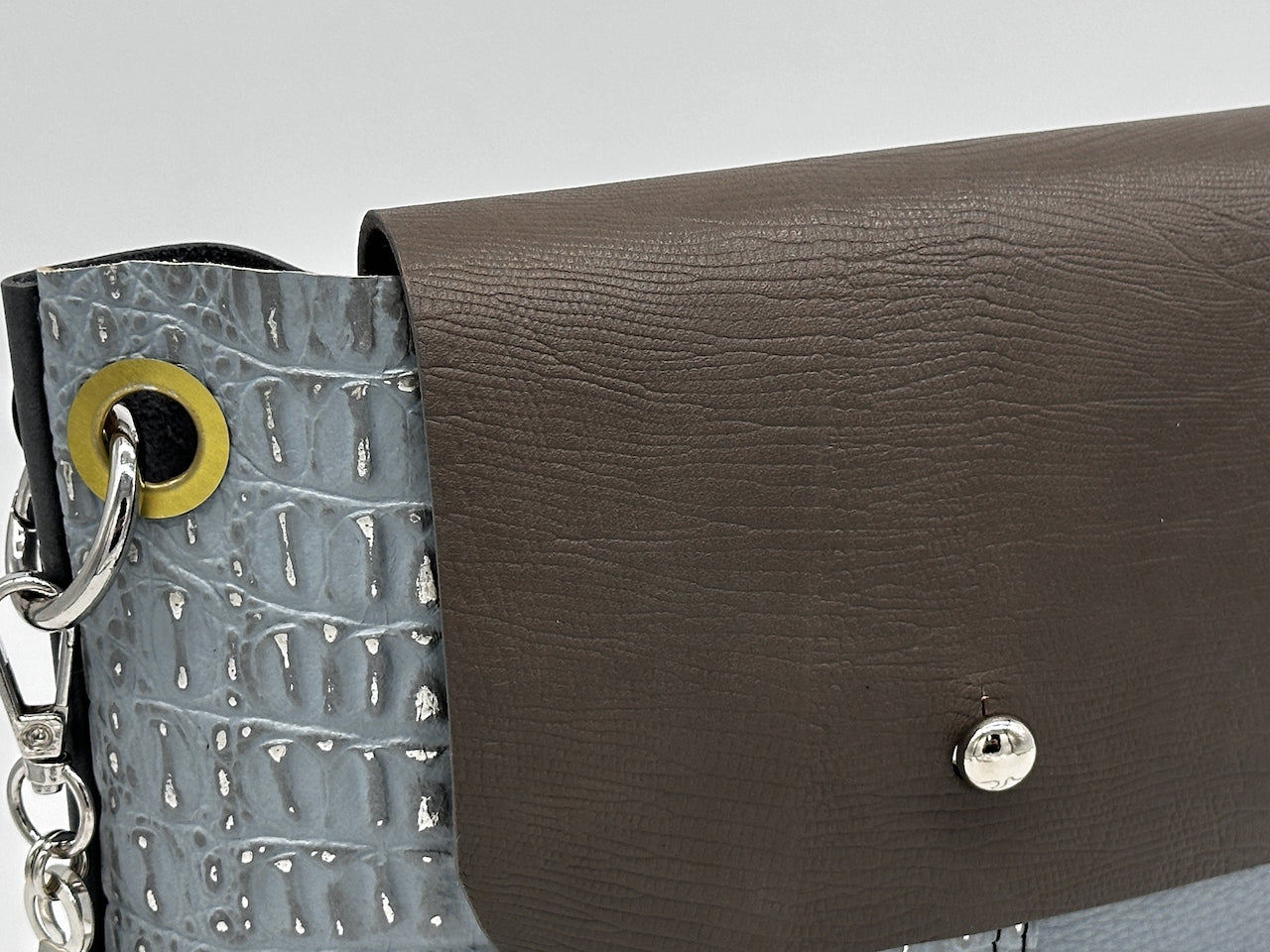 gray leather flap of purse