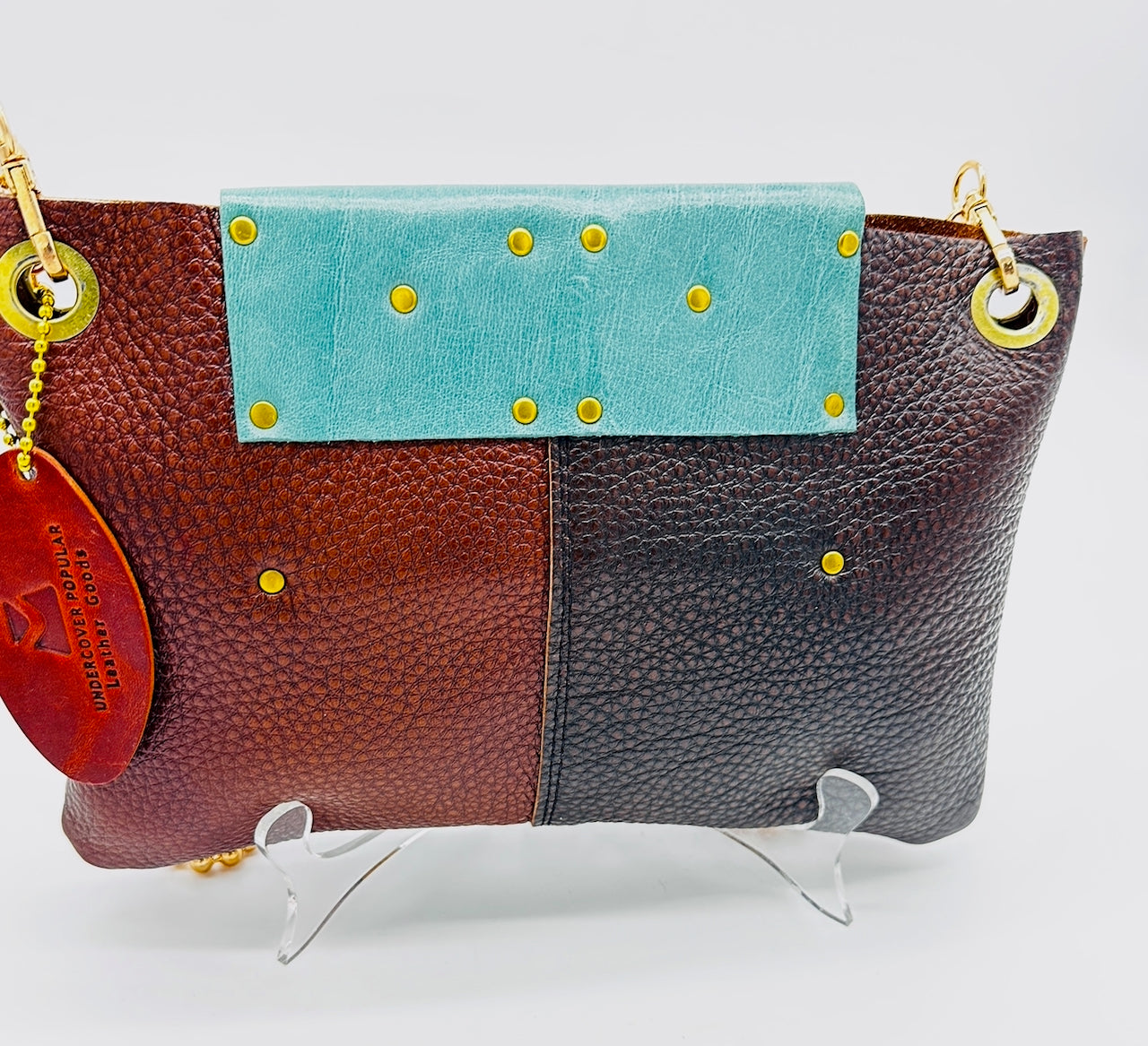 back view of leather purse on easel