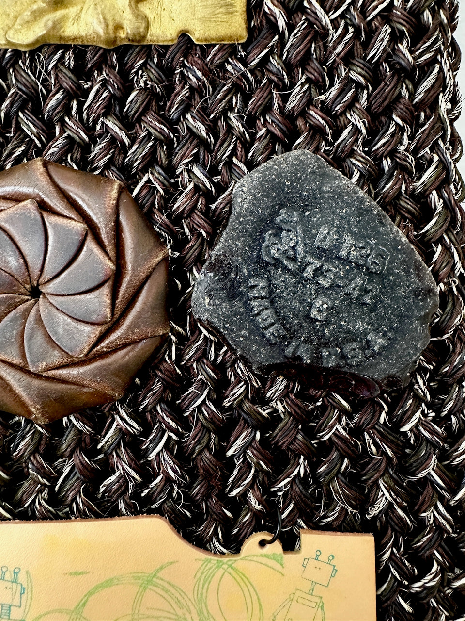 Two found objects on a textured surface 
