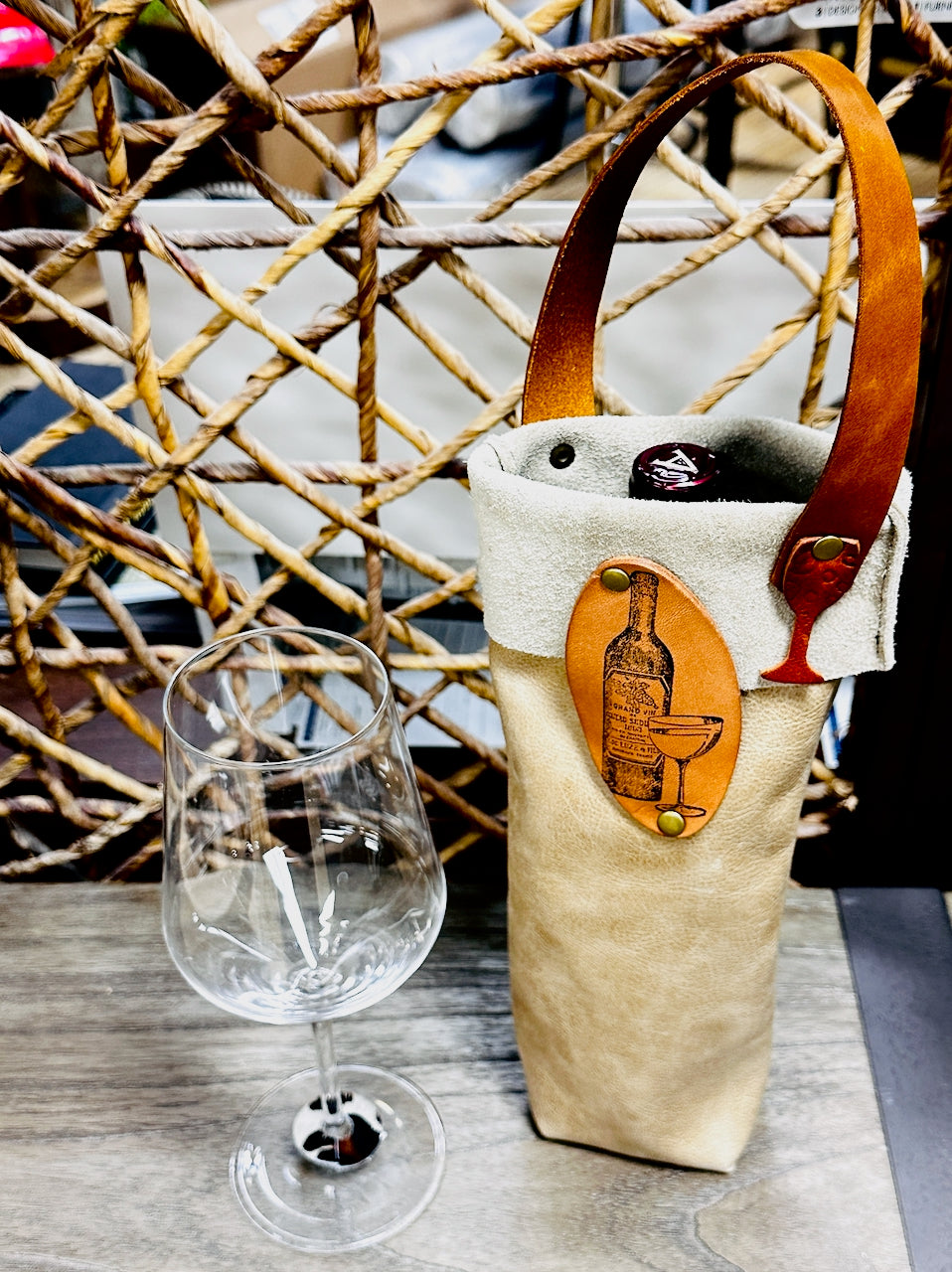 leather wine bottle with wine glass on table
