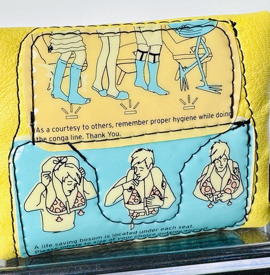 yellow leather wallet with cartoon illustrations and text on a yellow and blue background