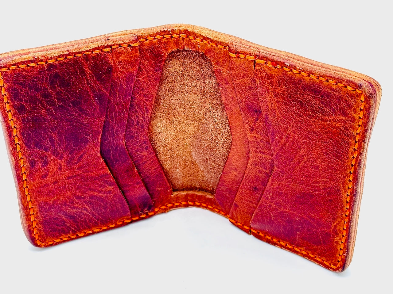 Cognac brown leather wallet with 6 compartments on a white background