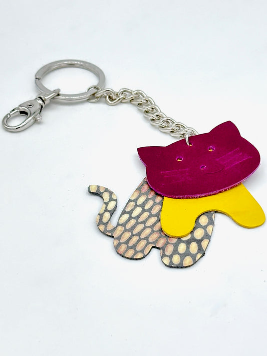 leather cat key chain purse fob in bright violet, yellow and patterned patent leather.
