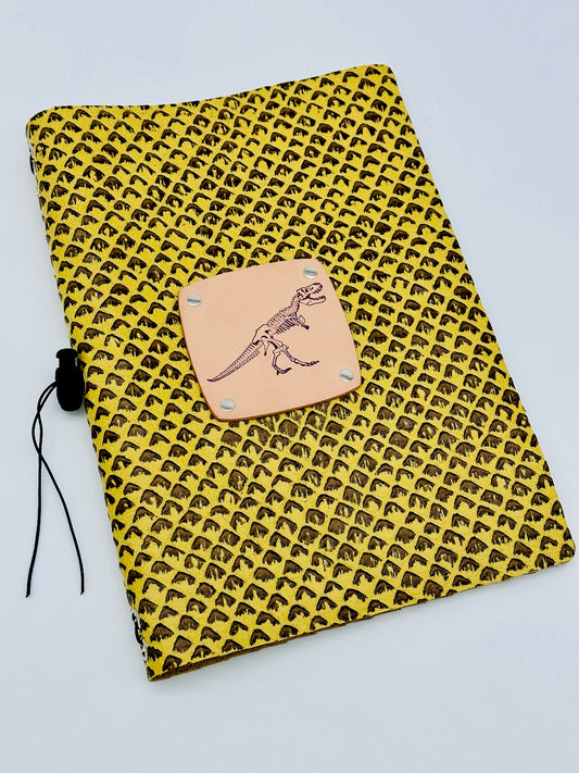 leather journal with stamped dinosaur and scaled leather
