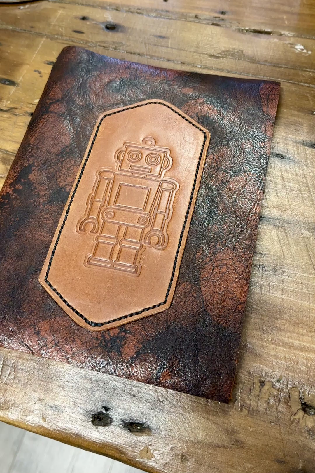 movie flipping open cover of robbie robot leather refillable journal to see blank lined paper notebook insert and back cover